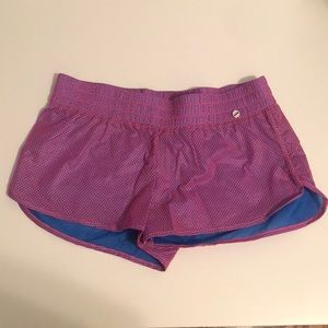 LJ Black hot pink mesh and blue workout shorts.